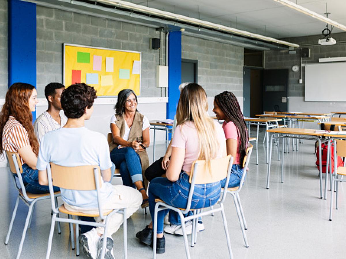 People sitting in chairs in a circle