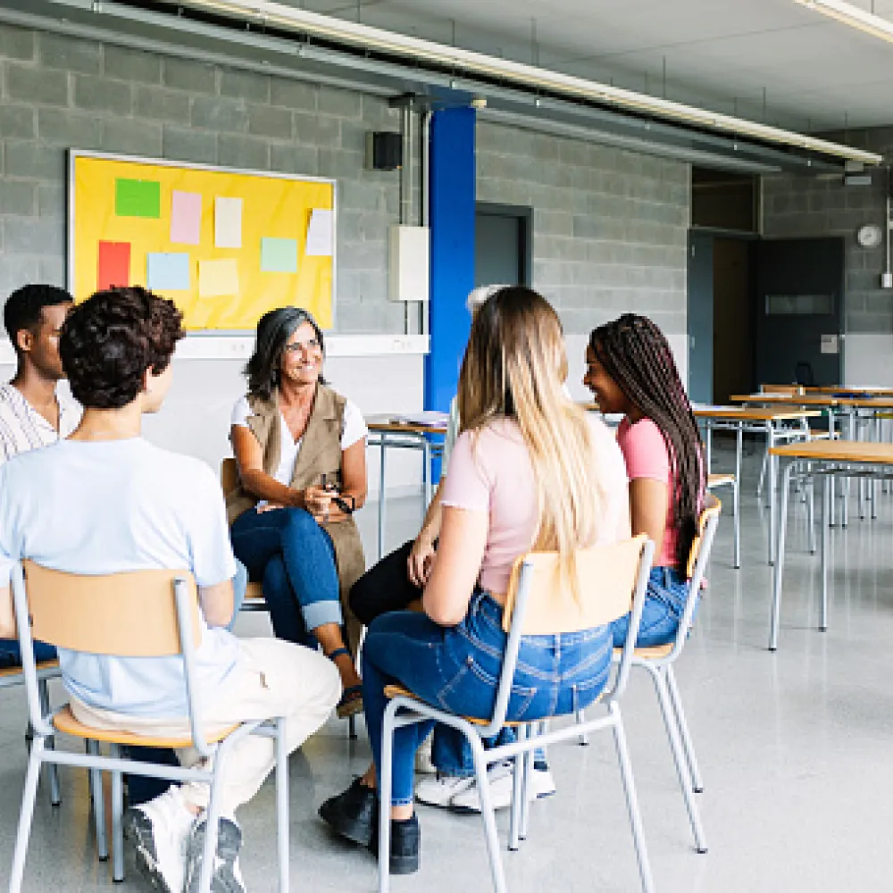 People sitting in chairs in a circle